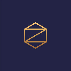 Z letter initial logo in hexagon shape with gold color.