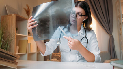 Doctor telehealth. Online diagnosis. Medical consultation. Woman physician examining lung x-ray...