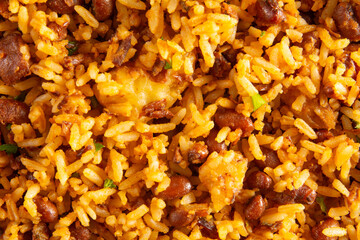 Baião de Dois traditional Brazilian food made with rice, beans, sausage and rennet cheese close up