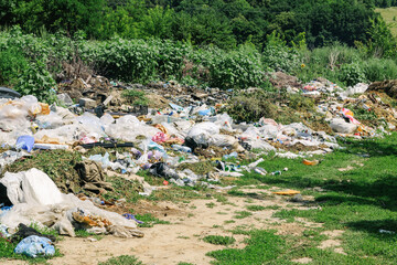 View of the landfill. Landfill A pile of plastic garbage, food waste and other garbage. Pollution of nature. A sea of garbage begins to invade and destroy beautiful landscapes.