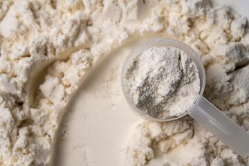 Protein whey powder with scoops. Food supplement, bodybuilding, fitness and gym lifestyle. 
