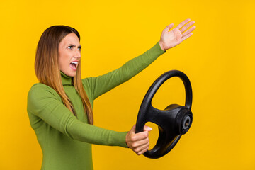 Profile photo of negative unsatisfied person hold wheel look empty space shout isolated on yellow...