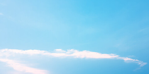 It's a hot day with the sun shining down on a blue sky filled with alternating small and huge clouds moving gently while the light from the sky creates a remarkable abstract shape. Horizon, Cloud Back