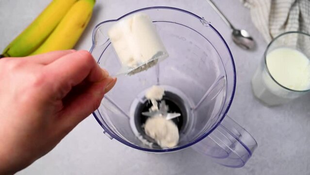 White protein whey powder and blender. Food supplement, bodybuilding, fitness and gym lifestyle. 