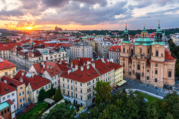 The aerial Prague cityscape of downtown and the castle and the St. Vitus Cathedral in sunset.  - obrazy, fototapety, plakaty