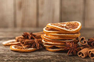 Fototapeta na wymiar Cinnamon sticks and anise on a textured background. Cinnamon roll and star anise. Spicy spice for baking, desserts and drinks. Fragrant ground cinnamon.Place for text. copy space.