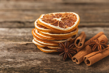 Cinnamon sticks and anise on a textured background. Cinnamon roll and star anise. Spicy spice for baking, desserts and drinks. Fragrant ground cinnamon.Place for text. copy space.