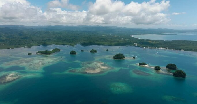 Sandy beach and cluster of small islands. Britania Group of Islands. Surigao del Sur. Philippines.