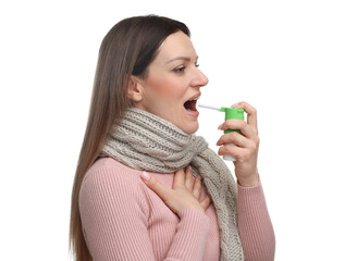 Woman using throat spray on white background