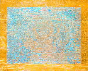 Worn blue paint on old wood plank with gold edge frame. Shabby plank with cracks and stains. Copy...