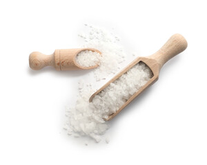 Natural salt and wooden scoops isolated on white, top view