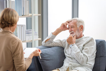 Elderly man consulting senior woman on the cozy sofa at home, Elderly medical health care concepts,...