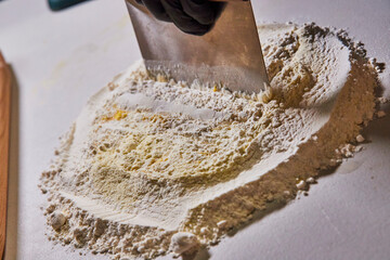 Baking Preparation with Flour and Bench Scraper, Gloved Hand Detail