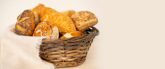 tempting array of buns, cheese and poppy seed rolls, pretzels, and cottage cheese pies presented in...