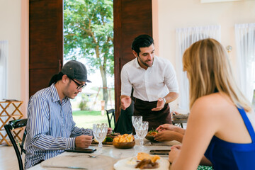 Engaging Service at the Eatery, Clients Enjoying Conversations while Waitstaff Attend, Cafe Scene Filled with Delicious Food and Beverages, Where Lifestyle Meets Business in Comfortable Dining