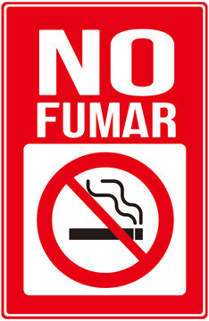 A sign in red color thats warns : no smoking in spanish language