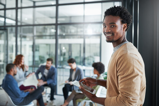 African man, happy and tablet in creative agency for internship, business and startup company. Professional, employee and seminar in office for collaboration, digital workshop and team building.