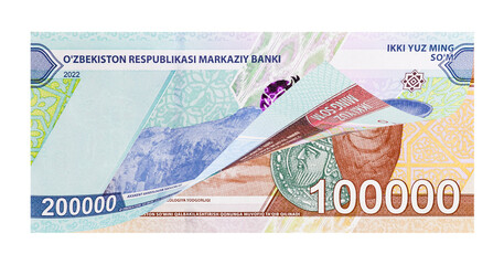 Uzbek two and one hundred-thousand banknotes as national money devaluation concept. Image isolated on white background