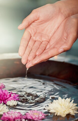 Water, flowers and hands at spa for skincare, wellness or relax at sustainable luxury salon. Finger, nail or organic bowl closeup for clean, beauty or person in healthy natural treatment for manicure