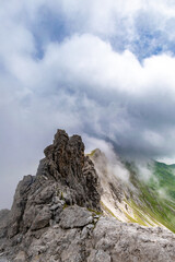 Clouds Over the Rugged Cliffs and Steep Slopes of Gamsluggen by Lünersee