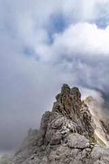 Clouds Over the Rugged Cliffs and Steep Slopes of Gamsluggen by Lünersee