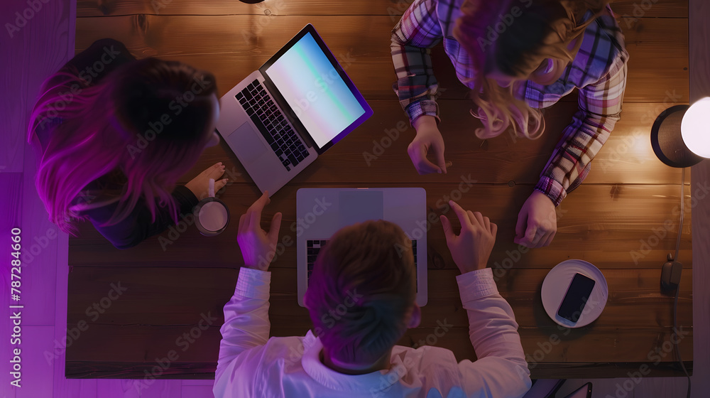 Aufkleber top view of a young woman and a young man who works with a laptops phone and tablet on the table dig