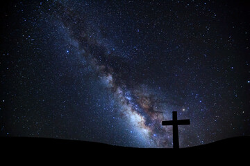 Cross silhouette on mountain with milky way galaxy, Night starry sky with stars