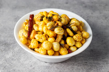 Selective focus of delicious Makhana chaat, made of roasted lotus seeds. 