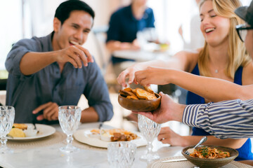 Happy Clients Enjoying Meals and Conversations at the Eatery: A Group of Friends Gathered Indoors,...