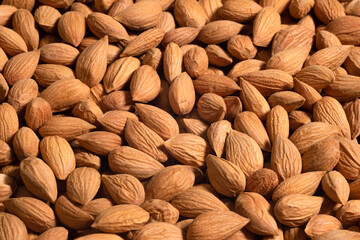 Background of large raw peeled almonds. Raw and whole dried nuts - 787289818