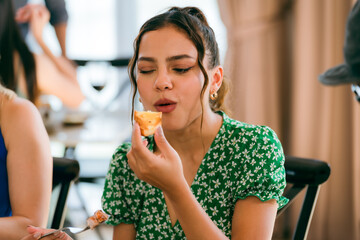 Happy Clients Enjoying Meals and Conversations at the Eatery: A Group of Friends Gathered Indoors, Smiling and Talking Over Lunch and Dinner, Creating Memorable Dining Experiences Together