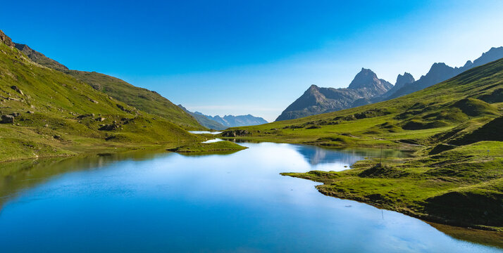 Tranquil Reflections: The Scheidseen Lakes Amidst Montafon's Alpine Majesty