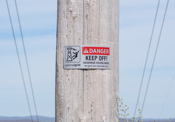 Denver keep off sign, power lines over the hills, copy space energy industrial background