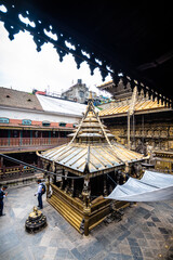 views of Hiranya Varna Mahavihar temple in kathmandu - 787294421