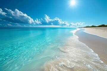 Wideangle view of a calm, turquoise sea meeting a white sandy beach under a sunny sky, embodying paradise