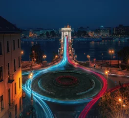 Fotobehang Kettingbrug Aerial view of traffic at Clark Adam Square roundabout with Szechenyi Chain Bridge and Danube river at night - Budapest, Hungary