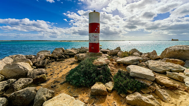 lighthouse on the shore of the sea, Fuseta, Portugal, Europe, February 2024,