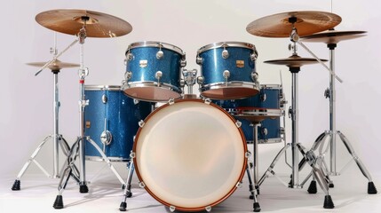a blue drum set with cymbals and stands