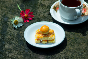 backed cake and tea with flowers