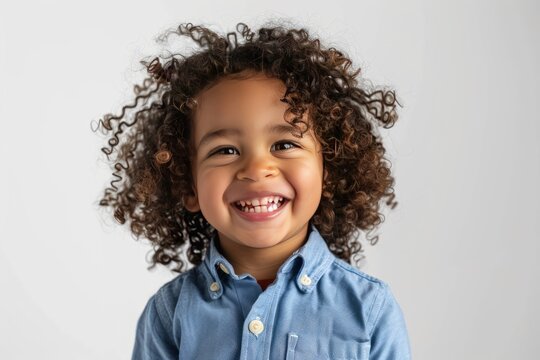 Photo of a happy mixed race child laughing with curly. Generate AI image