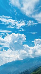 Blue Sky and White Clouds Over the Mountains Background. Beautiful Landscape Wallpaper with Soft Focus and Mountain Peak, Copy Space