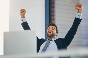 Laptop, success and winner with business man in office for celebration or achievement, goal or target. Computer, smile and success with happy young employee cheering for career bonus or promotion