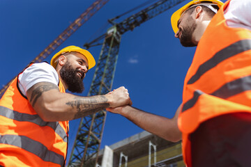 Contractor. construction worker team hands shaking after plan project contract  at construction site, contractor, engineering, partnership, construction concept - 787319064