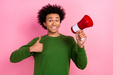 Photo of happy positive guy hold loudspeaker make like symbol isolated pastel color background