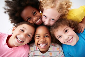 Happy smiling children in a circle looking down at the camera, bright colors, low angle shot from below with a top view, a portrait of joyful children playing and kids huddling, cute little children 