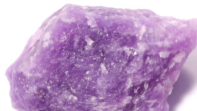 purple precious lepidolite stone that spins on itself