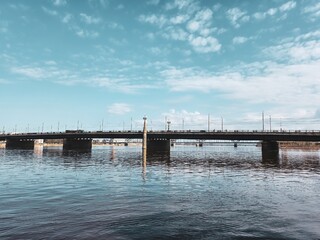 Obraz premium Cityscape of Riga, Latvia, with Stunning Architecture and Magnificent Bridge Over the Daugava River, Reflecting the Charm and Beauty of this Vibrant European Capital.