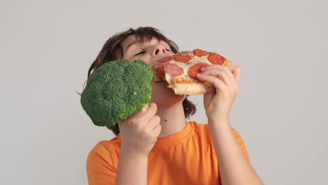 Boy contemplates a slice of pizza while clutching a toy, reflecting the whimsy and choices in a child s life. A slice of life's simple joys.