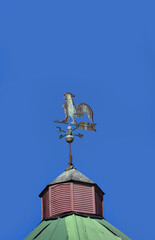 Rooster Weather Vane on Tin Roof