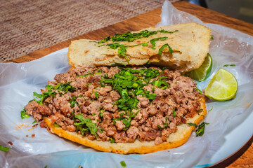Gordita of beef with vegetables and sauce Mexican food dish